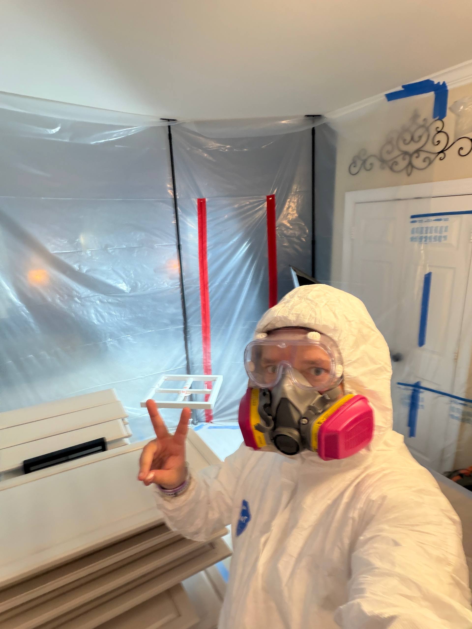 Spray technician in full PPE and respirator — Carolina Renew cabinet refinishing, Waxhaw NC
